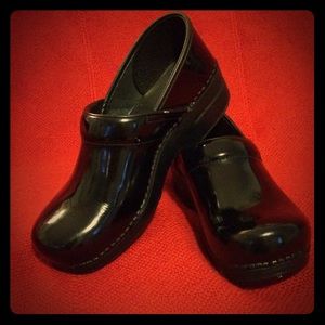 Dansko patent leather clogs